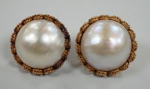 A pair of modern continental yellow metal and mabe pearl set ear clips, diameter 22mm, gross