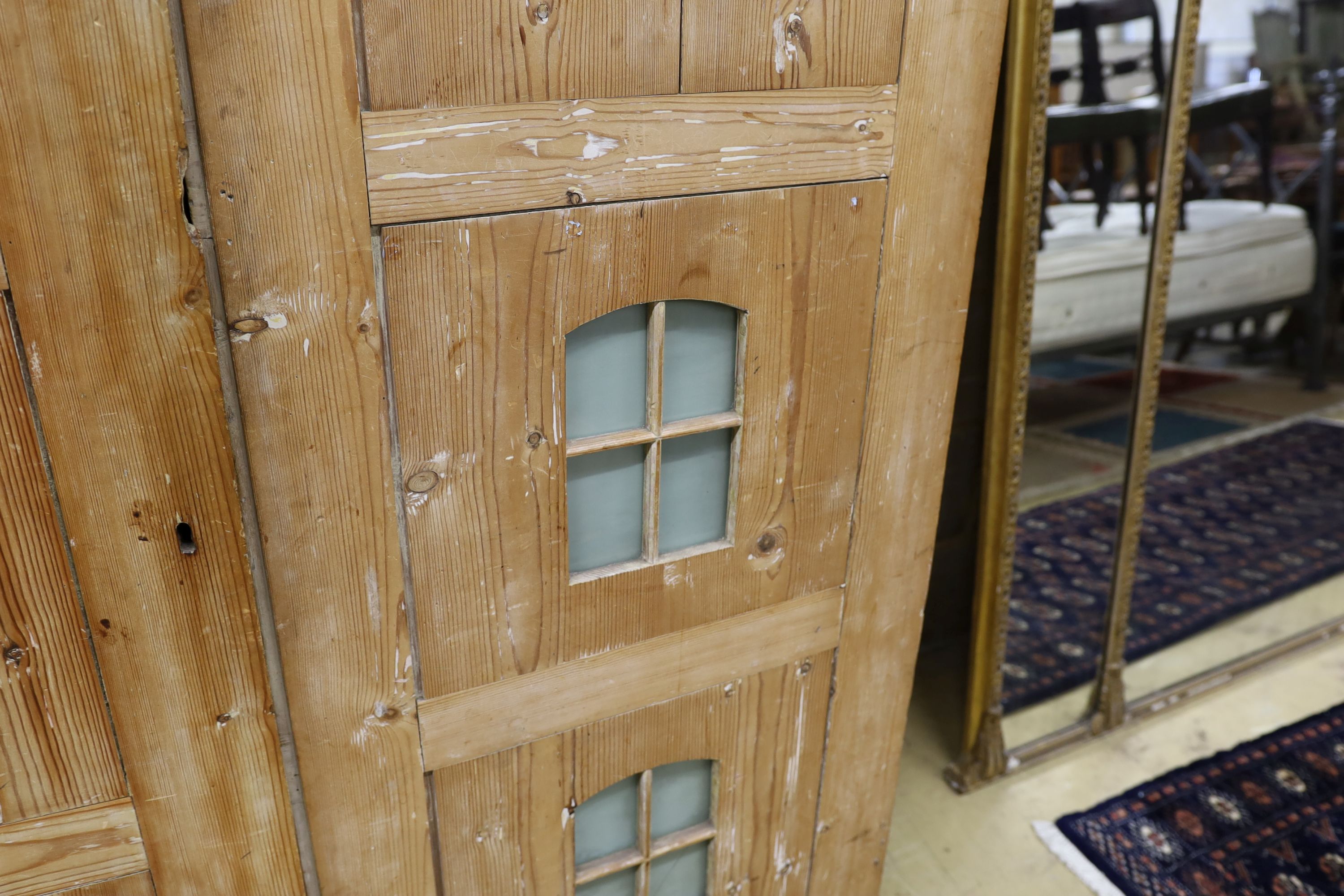A 19th century stripped pine hall cupboard modelled as a dolls house the two door nine window facade - Image 9 of 20