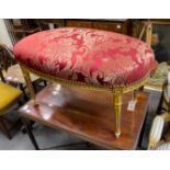 A Louis XVI style oval giltwood upholstered dressing stool, length 90cm, depth 50cm, height 50cm