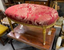 A Louis XVI style oval giltwood upholstered dressing stool, length 90cm, depth 50cm, height 50cm