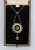 A 9ct and two stone peridot set drop pendant necklace, pendant 38mm, chain 43cm, gross weight 4.7