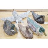 Five primitive wood decoy ducks, one in flight, longest 40cm