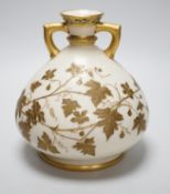 A Royal Worcester gilded vase of bulbous form, 17cm