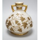 A Royal Worcester gilded vase of bulbous form, 17cm