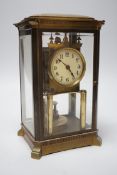 A brass four glass Anniversary clock, 29cms high