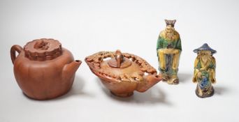 A Chinese carved soapstone pot, a terracotta teapot, and two earthenware figures, tallest figure