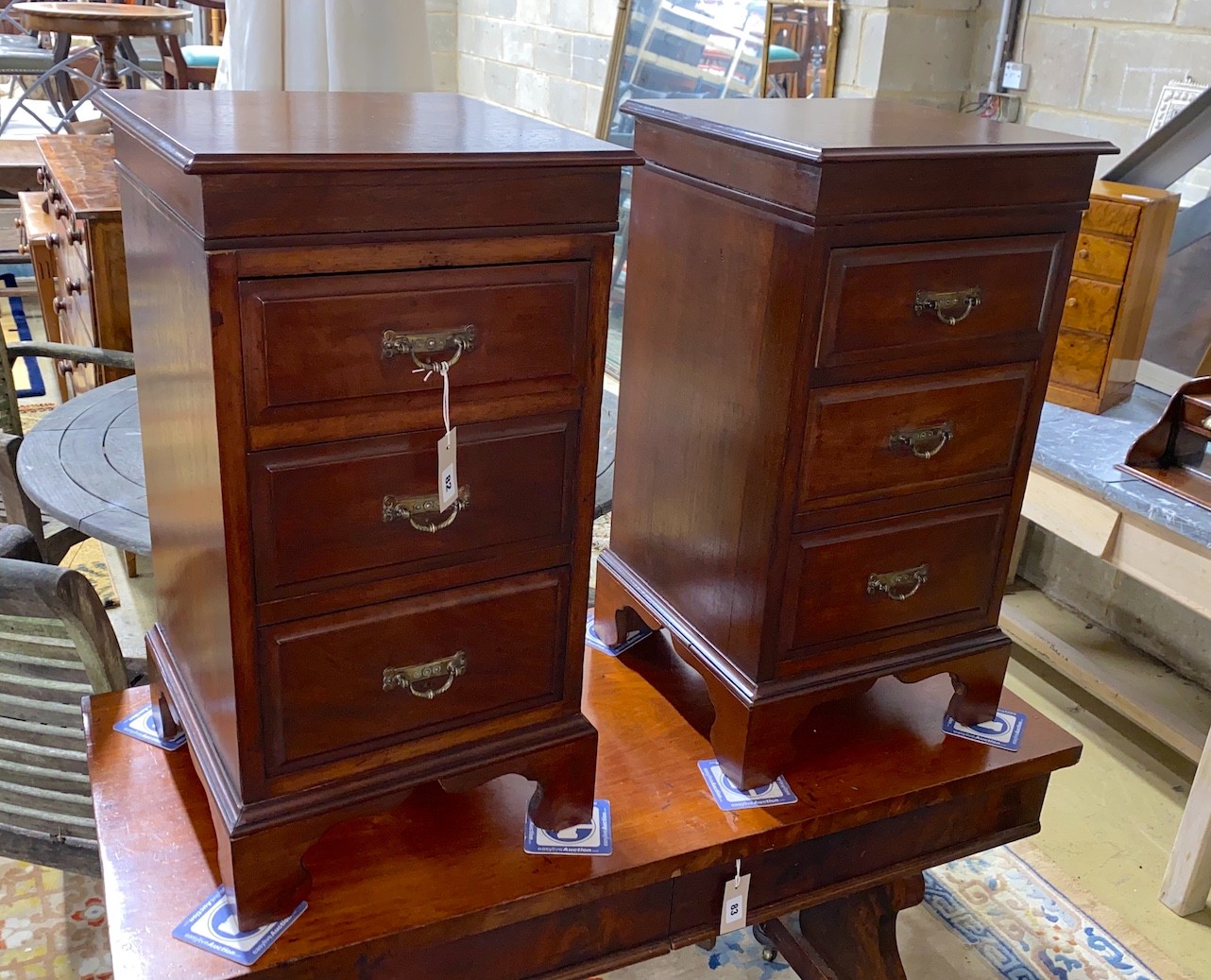A pair of Victorian and later mahogany three drawer bedside chests (altered), width 39cm, depth