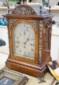 A late Victorian oak bracket clock with brass mounts and chiming movement, 55cms high