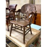 A 19th century Continental carved oak tub framed elbow chair on turned spiral underframe, width