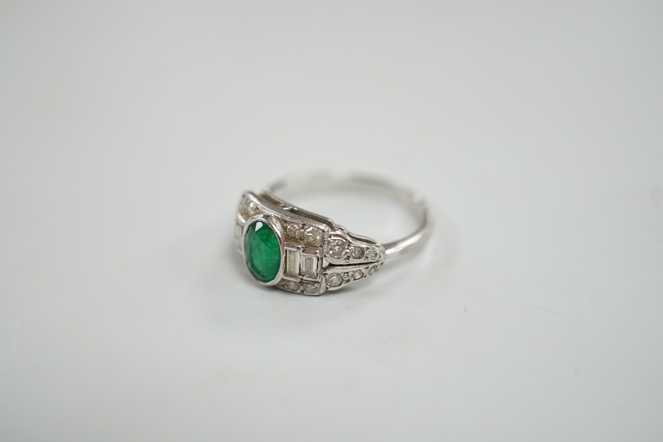 An Art Deco white metal, singe stone oval cut emerald and round and baguette cut diamond cluster set - Image 2 of 4