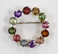 A yellow metal and multi gem set openwork circular brooch, 32mm, gross weight 5 grams.