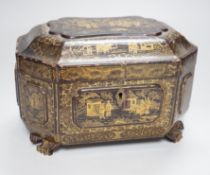 A 19th century Chinese chinoiserie lacquered sarcophagus form tea caddy, pewter lined interior