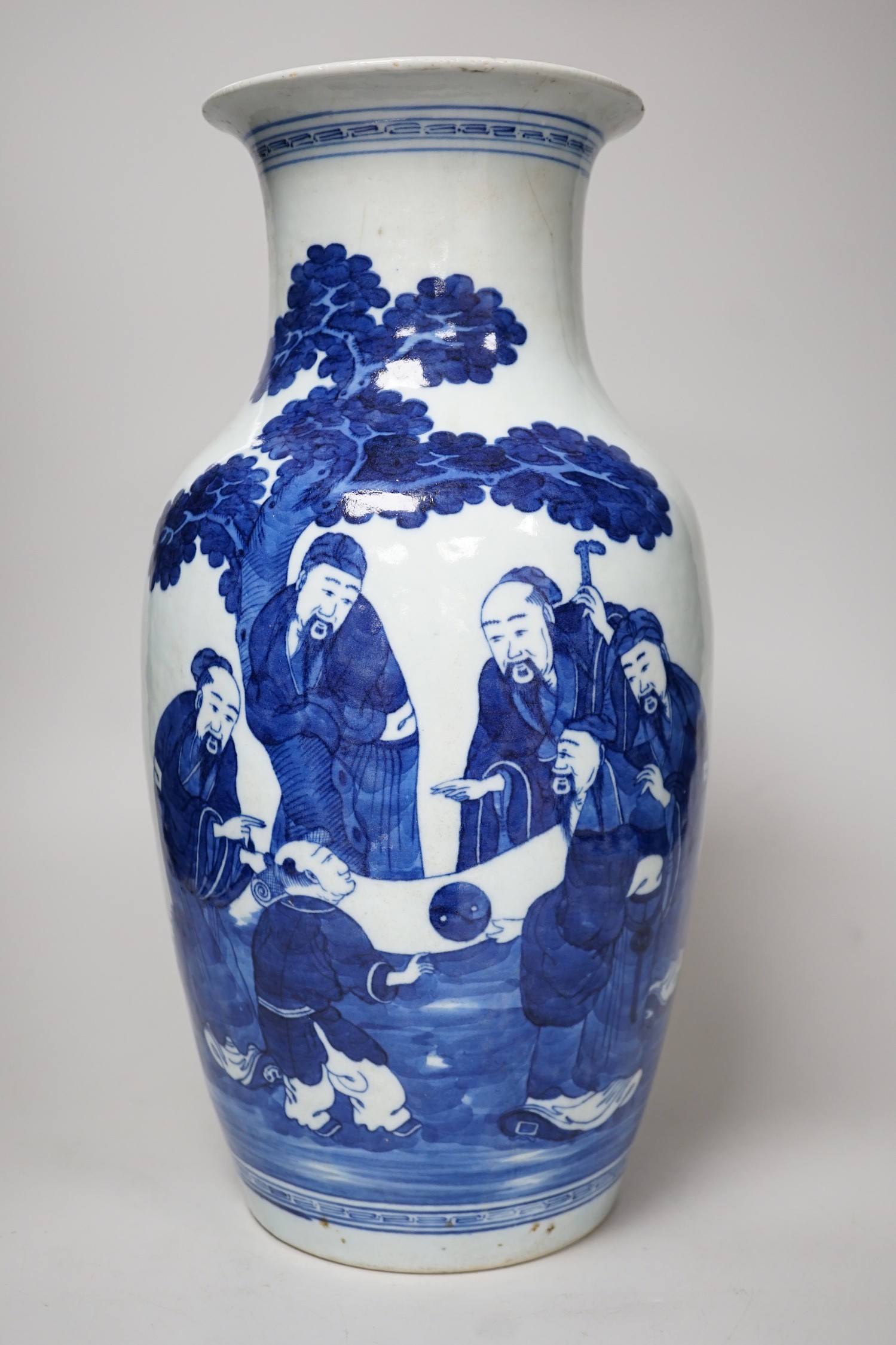 A large Chinese blue and white export vase, decorated with sages and attendants reviewing a