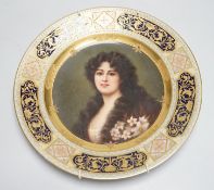 A Vienna cabinet plate with portrait painting to centre, underglaze blue beehive mark to reverse.