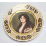 A Vienna cabinet plate with portrait painting to centre, underglaze blue beehive mark to reverse.