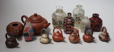 A collection of Chinese scent bottles, miniature and yixing teapots