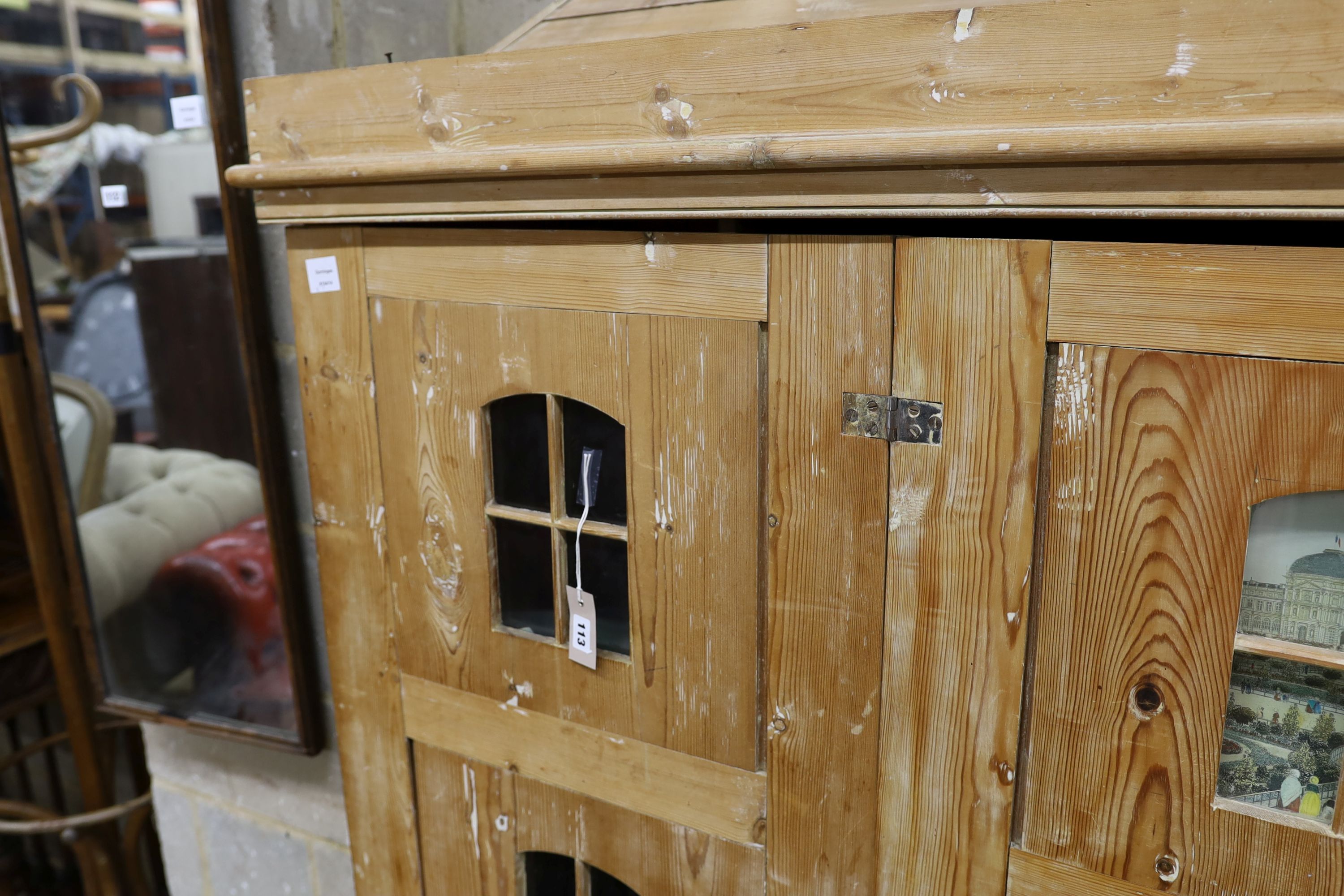 A 19th century stripped pine hall cupboard modelled as a dolls house the two door nine window facade - Image 2 of 20