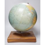 A Philips Challenge Globe, on stand, 46cm high, with atlas