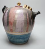 A Doug Bignell 'Mad Hatter's Tea Party' teapot and a hand needle worked tea cosy, inscribed “399nice