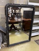A 19th century French ebonised overmantel mirror, width 104cm, height 147cm