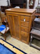 An early 20th century 'S.B.S.' furniture oak compactum with hinged mirrored top, width 102cm,
