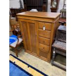 An early 20th century 'S.B.S.' furniture oak compactum with hinged mirrored top, width 102cm,