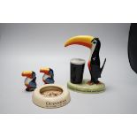 A Guinness toucan lamp-stem, 26cm high, and three related items