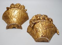 A pair of carved giltwood basket wall sconces, 29cms high