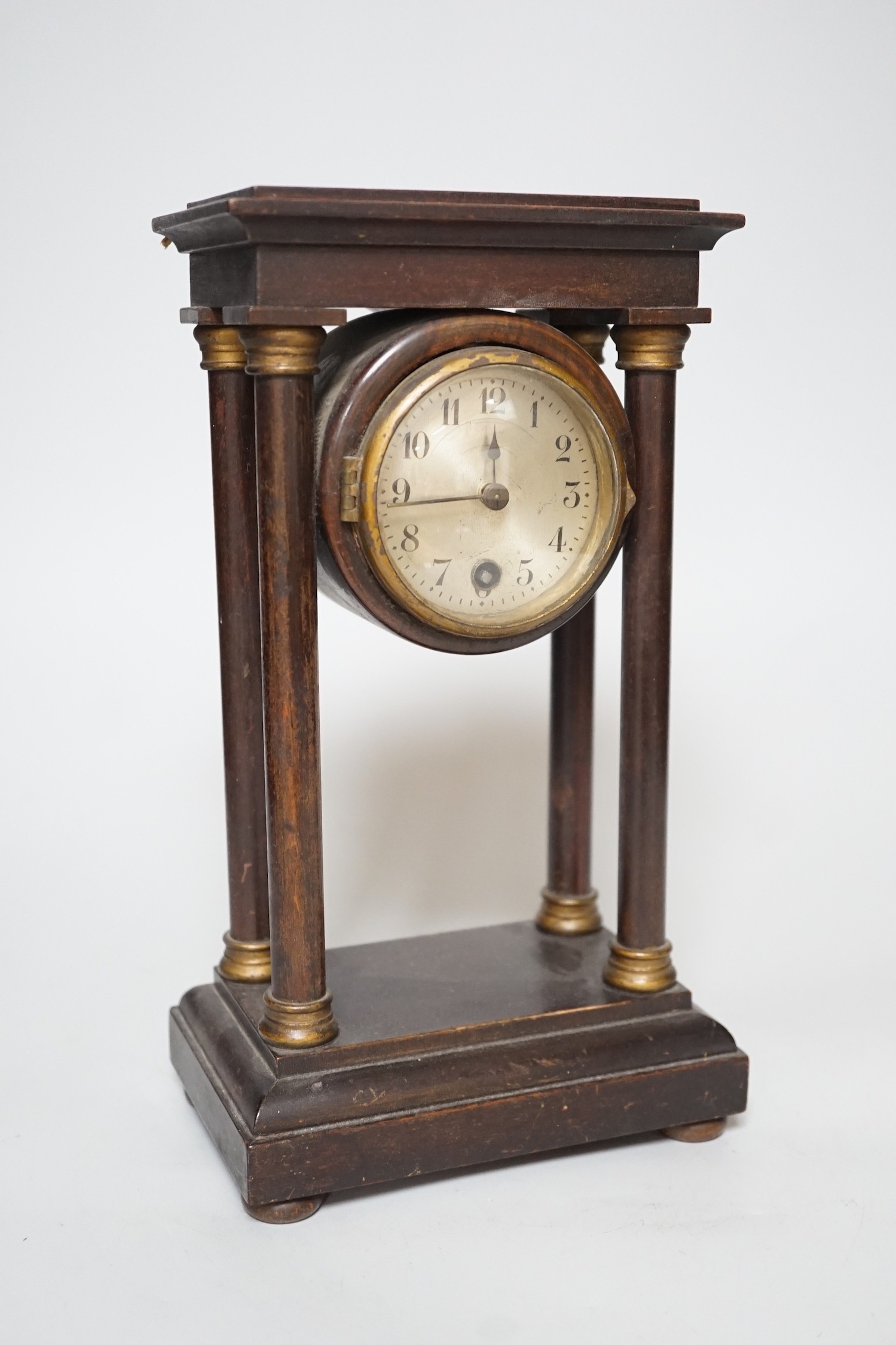 An Edwardian Portico-type mantel clock, 27cms high