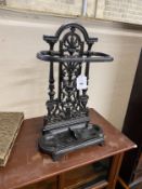 A small Victorian cast iron stick stand, width 31cm, height 50cm