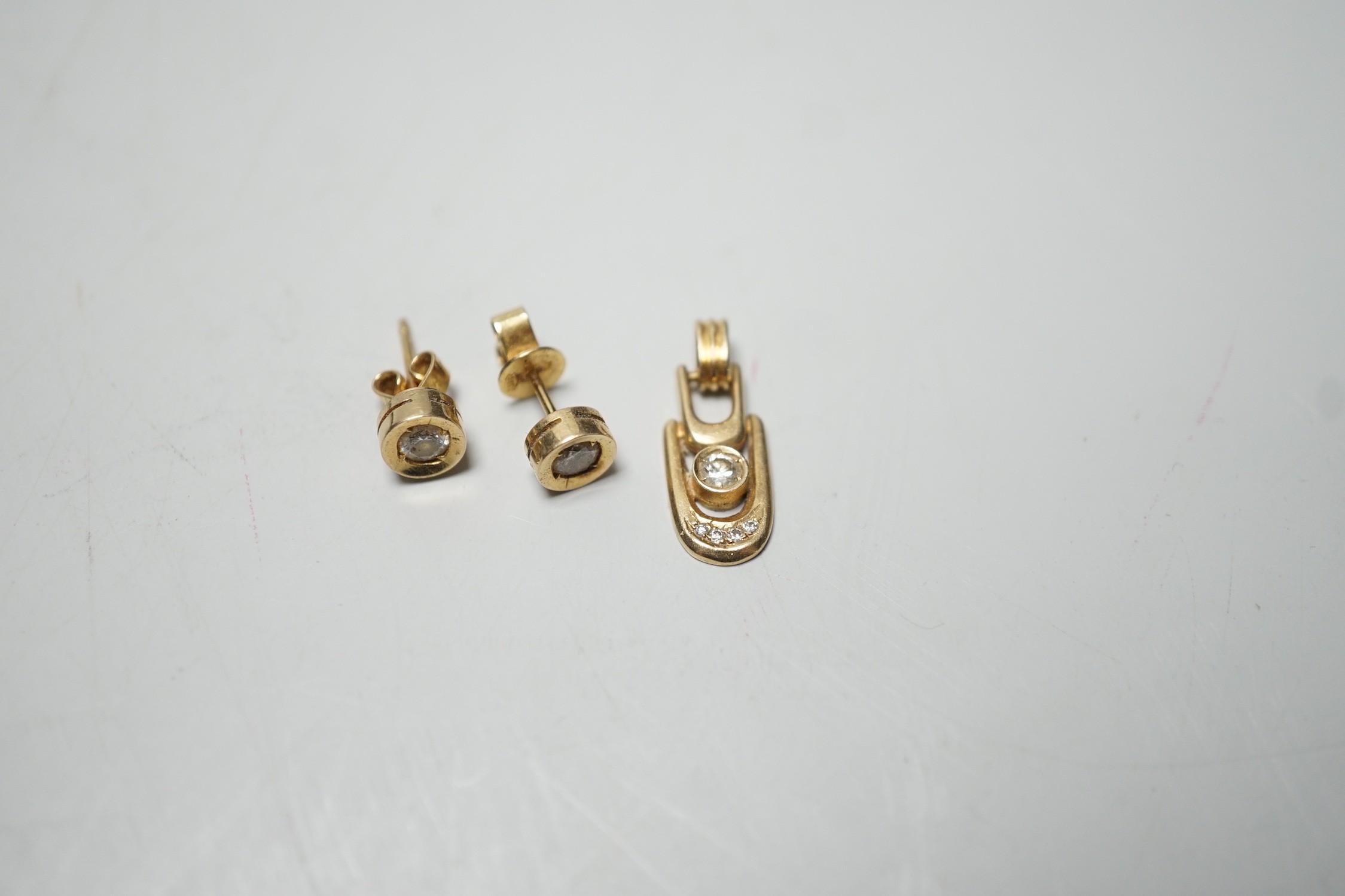 A modern pair of 585yellow metal and solitaire diamond set ear studs, 6mm and a matching pendant, - Image 3 of 5