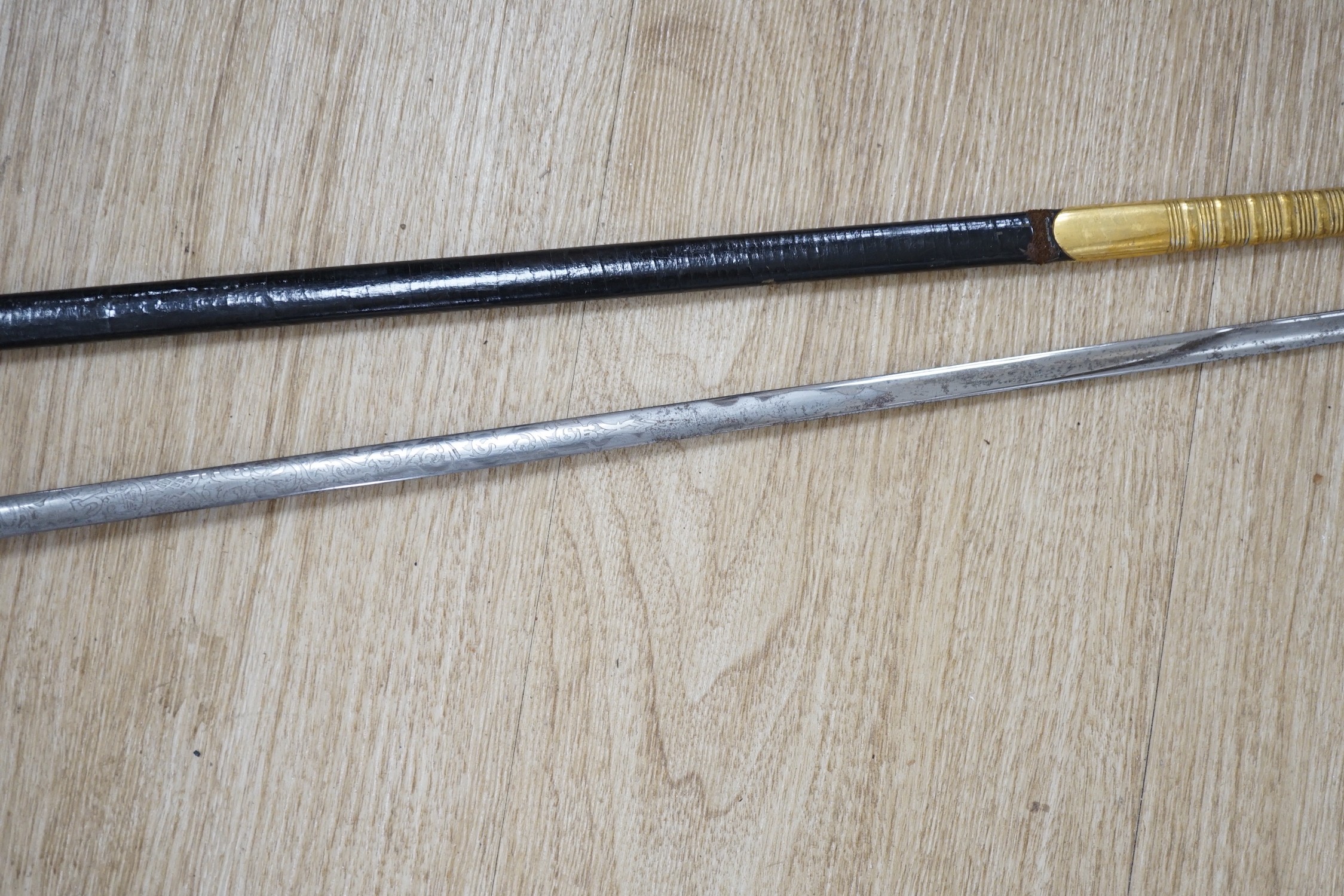 A 19th century officer's dress sword, made by Silver &Co. London with scabbard and leather cover - Image 4 of 5