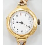 An early 20th century 18ct gold manual wind wrist watch, with Arabic dial, case diameter 27mm, on