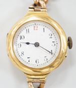 An early 20th century 18ct gold manual wind wrist watch, with Arabic dial, case diameter 27mm, on