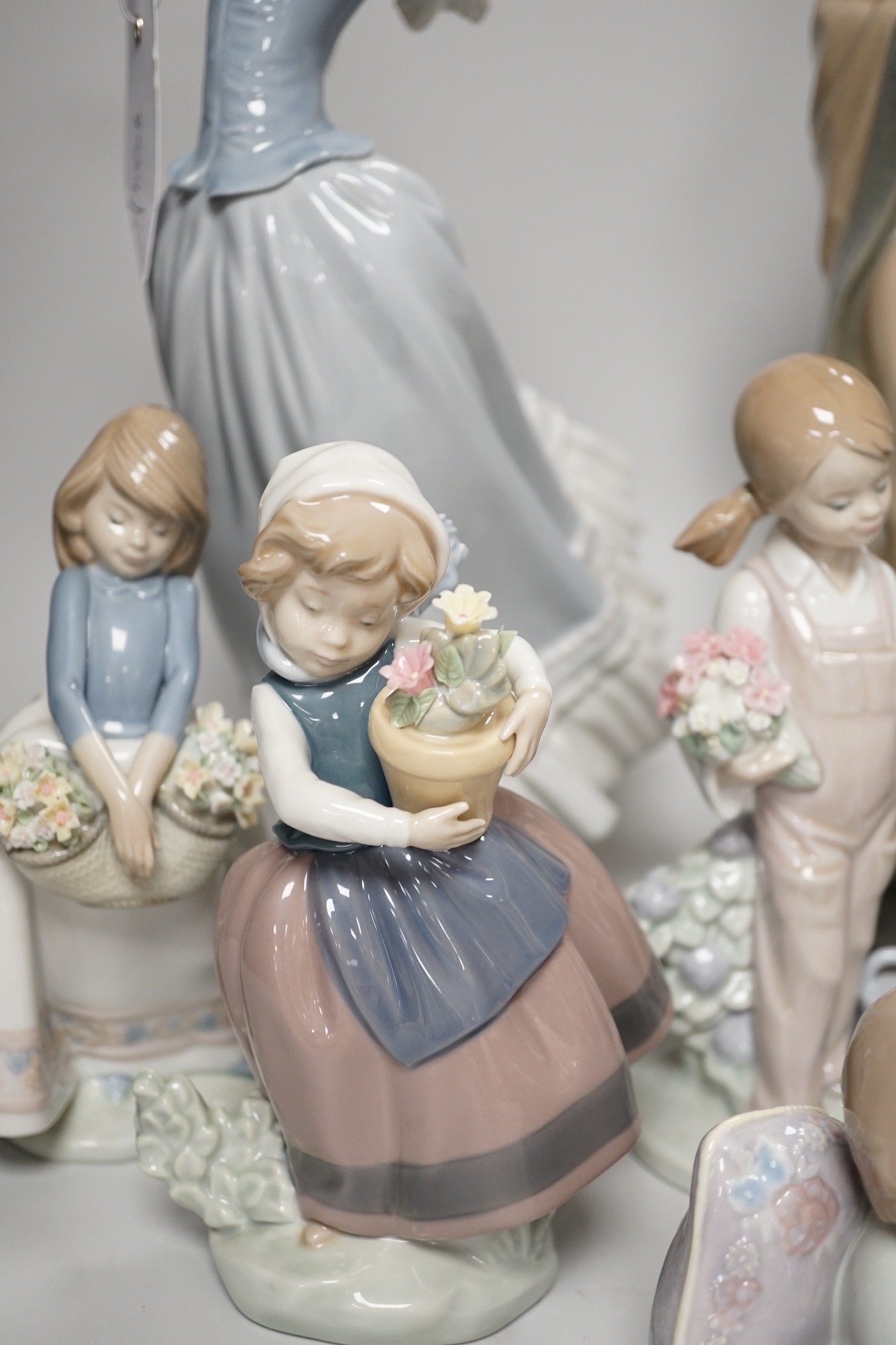 Seven Lladro and two Nao porcelain figures together with another, stuck to base so mark can’t be - Image 7 of 9
