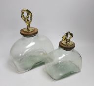 Two graduated large green glass bottle canisters with ornate brass sculptural covers, cars mark ‘