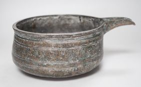 An early Islamic tinned copper pouring vessel, Egypt or Syria, 26cm long, Kufic inscriptions