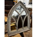 A gothic style painted arched wall mirror, width 66cm, height 81cm