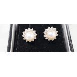 A modern pair of 18ct white gold, cultured pearl and diamond cluster set ear studs, 11mm, gross