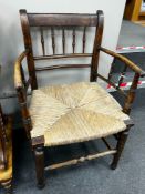A 19th century ash and beech rush seat provincial elbow chair, width 55cm, depth 41cm, height 85cm