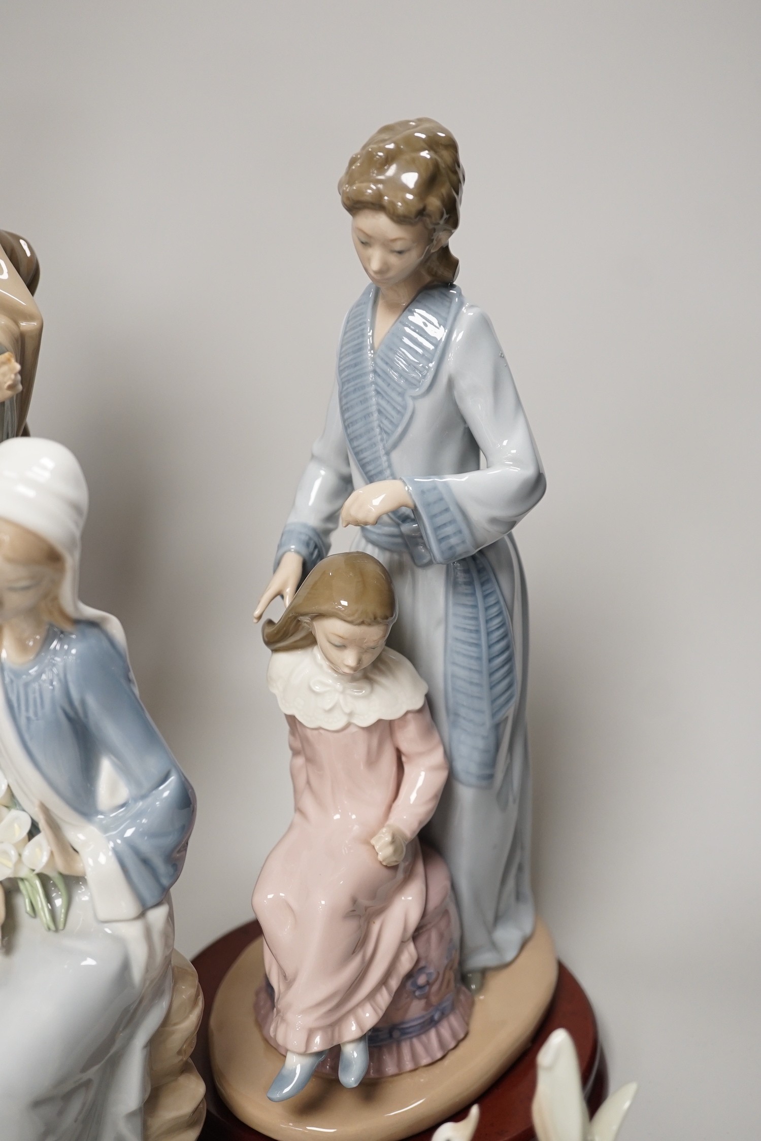 Seven Lladro and two Nao porcelain figures together with another, stuck to base so mark can’t be - Image 6 of 9