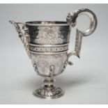 A mid 20th century Spanish? white metal ewer, with engraved, caryatid and mask decoration, height