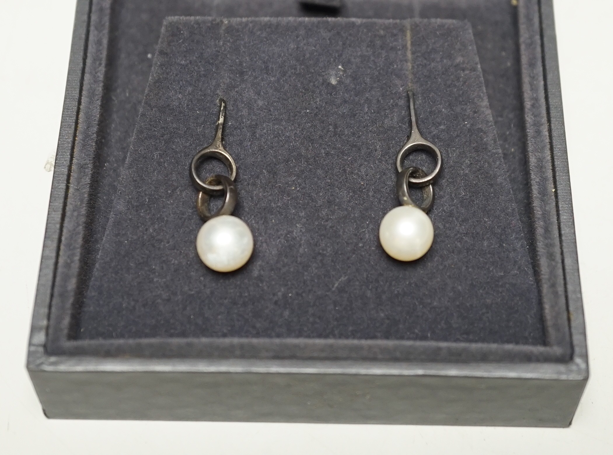 A modern pair of Georg Jensen silver and cultured pearl set drop earrings, 31mm, in Georg Jensen