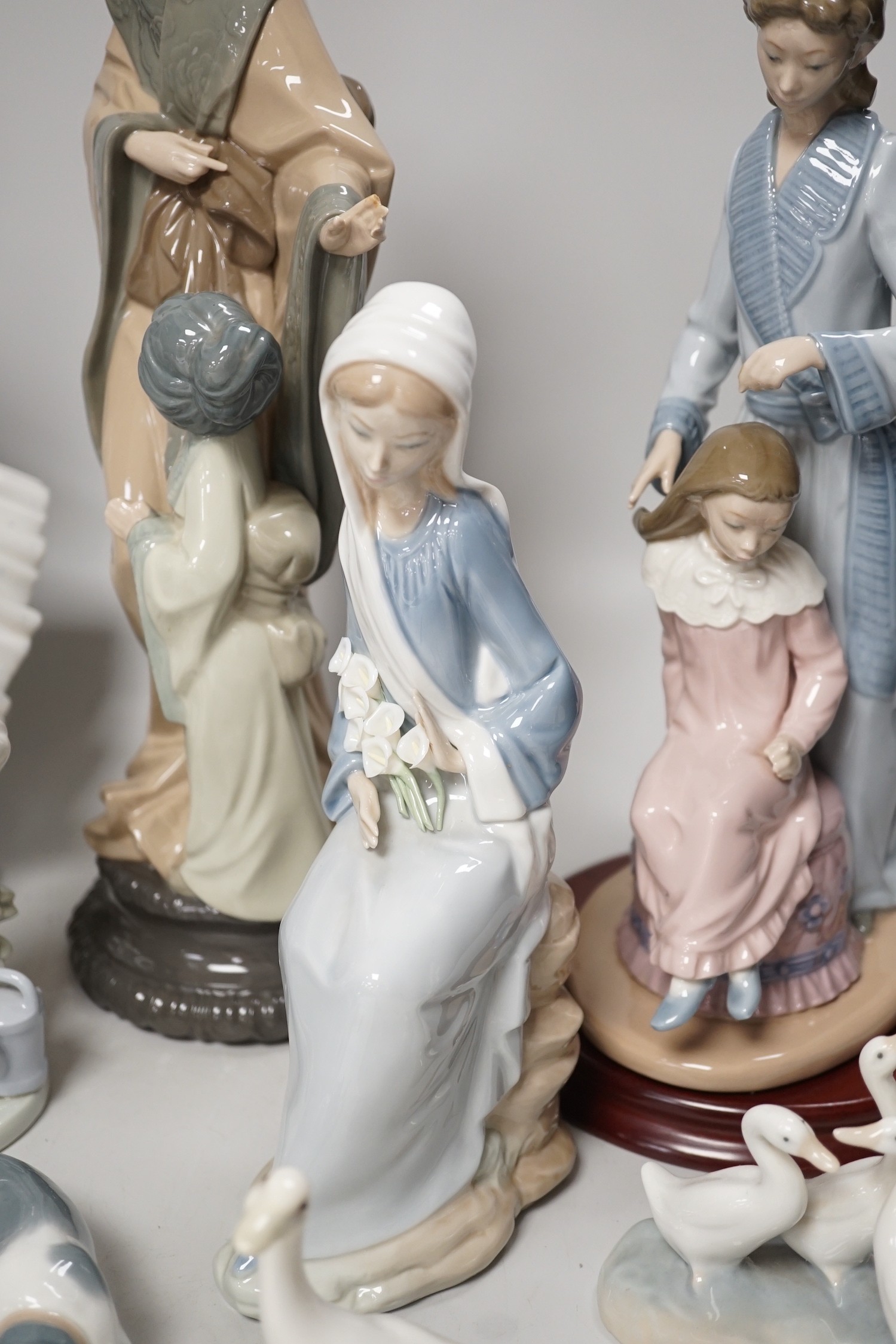 Seven Lladro and two Nao porcelain figures together with another, stuck to base so mark can’t be - Image 5 of 9