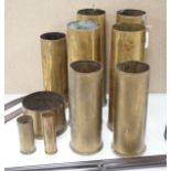 A group of WWI shell casings and two bayonests