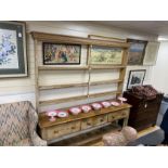 A large 19th century pale pine kitchen three drawer dresser, with open rack, length 214cm, depth
