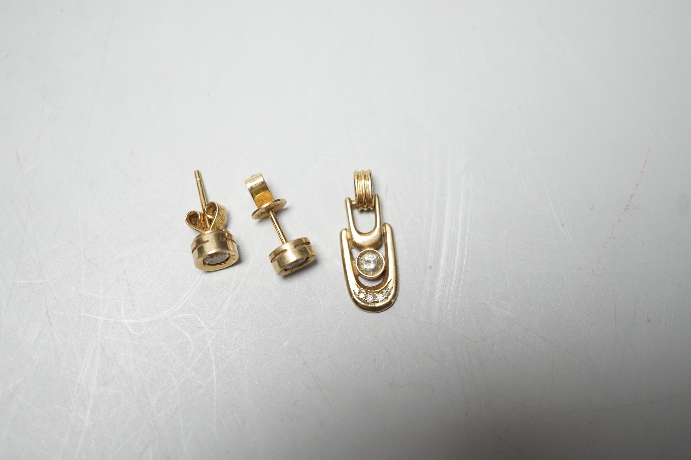 A modern pair of 585yellow metal and solitaire diamond set ear studs, 6mm and a matching pendant, - Image 2 of 5