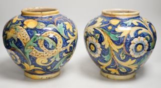 A pair of Italian maiolica flower and fruit painted jars, 22cm tall