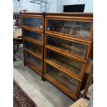 A pair of Globe Wernicke four section walnut bookcases, length 87cm, depth 31cm, height 147cm