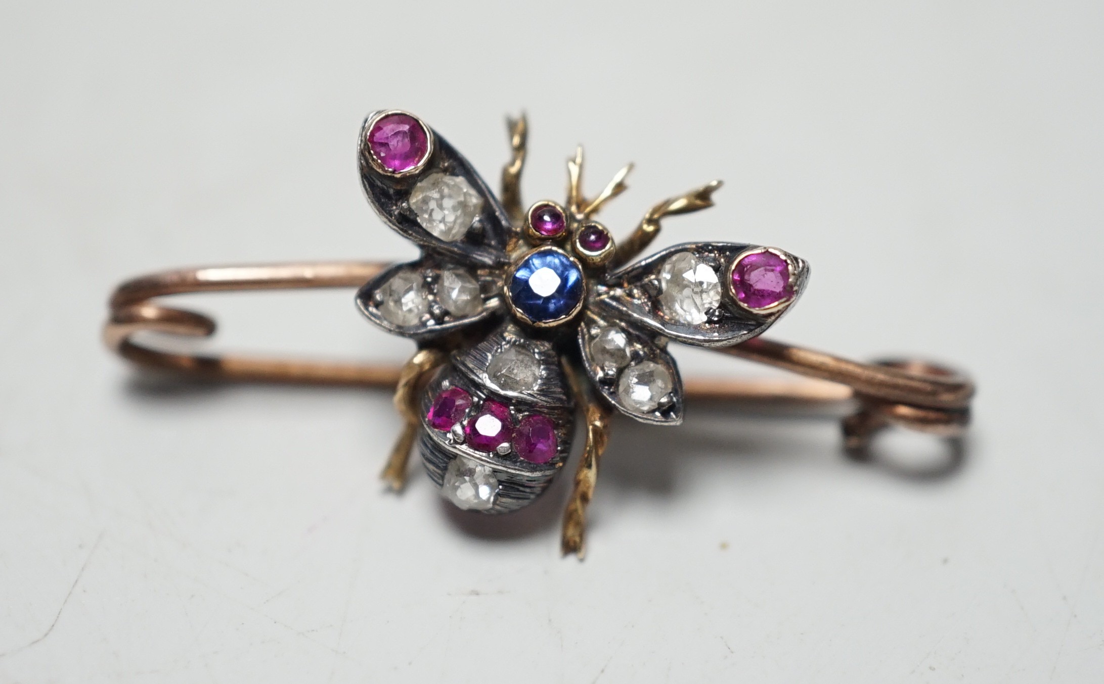 A late Victorian yellow metal, ruby, sapphire and diamond set bug brooch, 30mm, gross weight 2.2